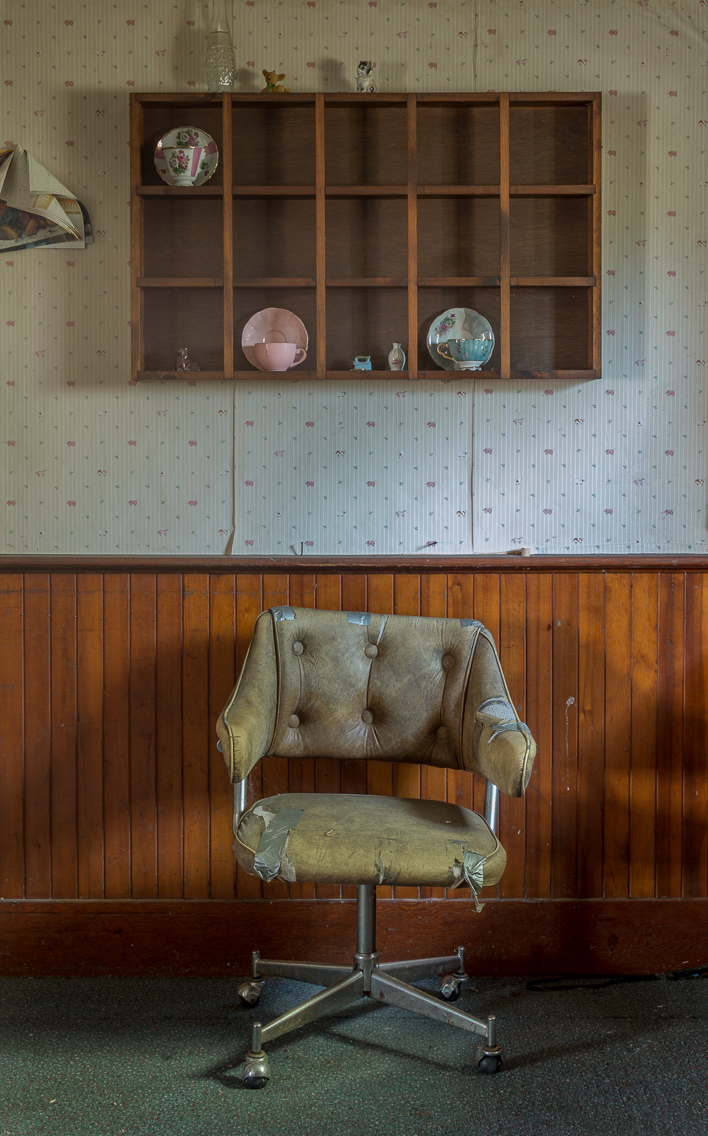 A haggard wellworn kitchen chair in an abandoned house in Ontario